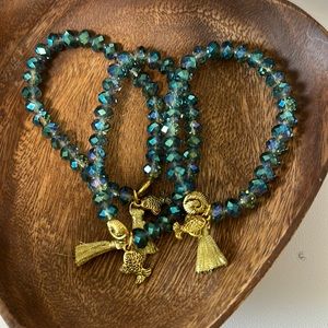 Gorgeous beaded bracelet with gold tassel and charms